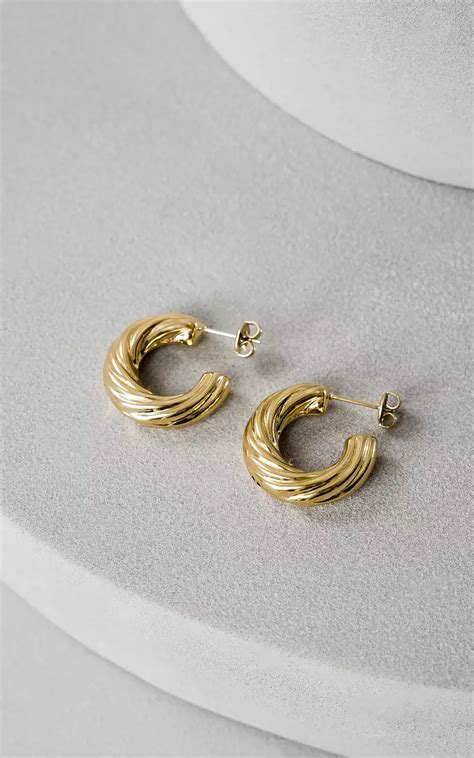ysl oorbellen goud